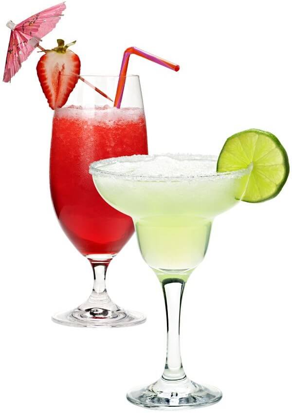 Red and Green Cocktails Red Strawberry Daiquiri Cocktail in a long glass with red straw, paper umbrella and strawberry slice behind a margarita glass with green hued frozen margarita topped with a slice of lime.